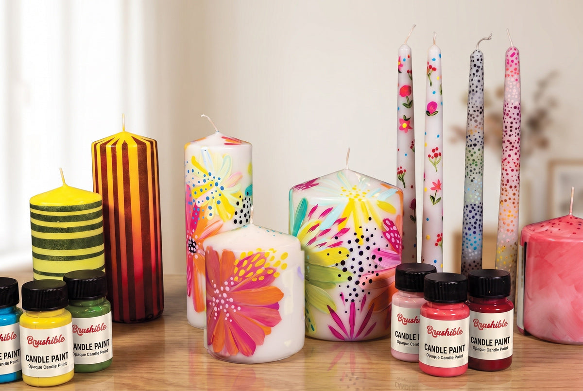 Hand-painted candles with Brushible Opaque Candle Paint on a sideboard at home