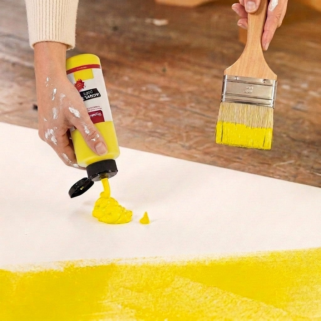 Brushible Everyday acrylic — squeezing yellow paint, brush in hand