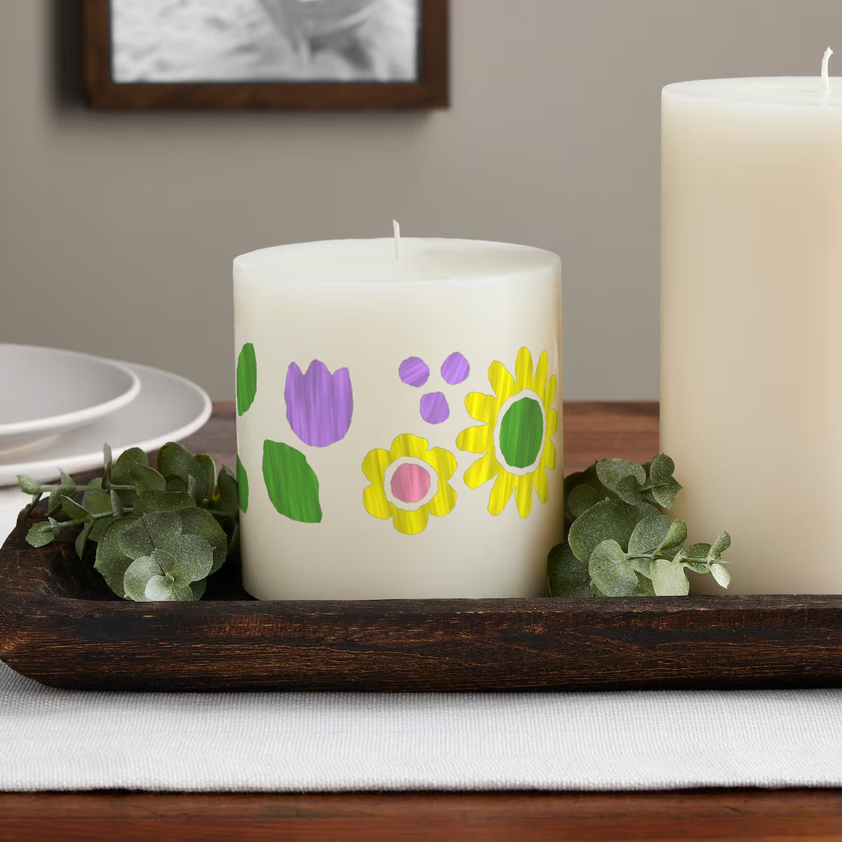 Flower Patch paint by numbers candle on a table: the finished design painted on an ivory pillar candle
